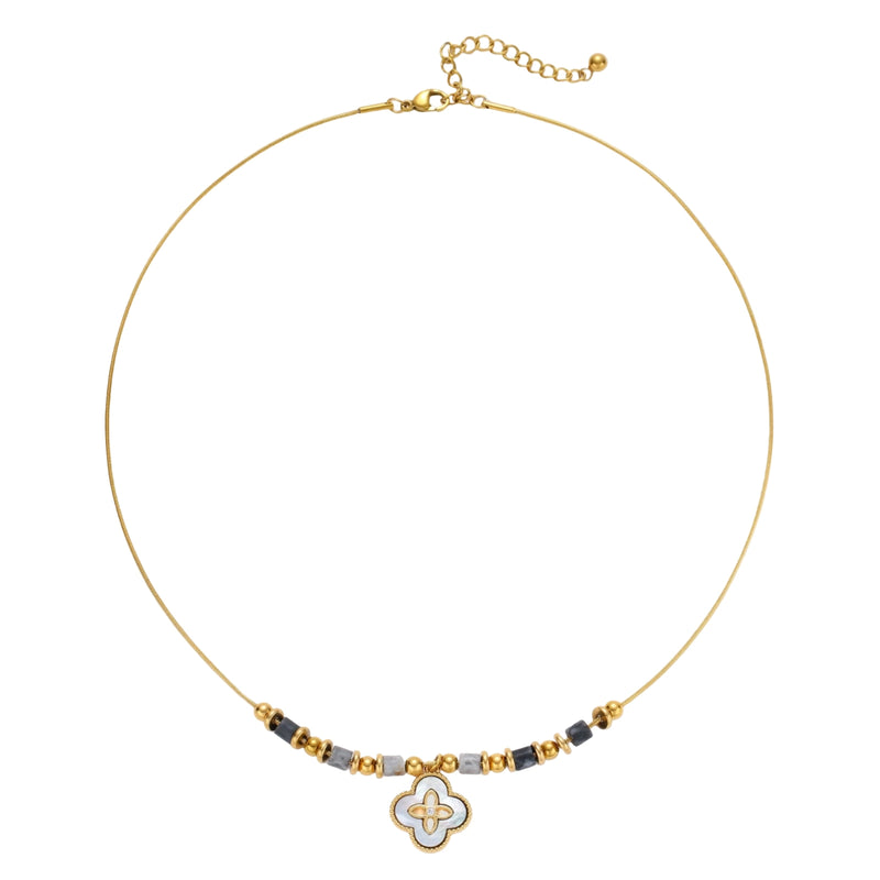 Gold-toned beaded necklace with grey stones and quatrefoil abalone shell pendant on cream background.